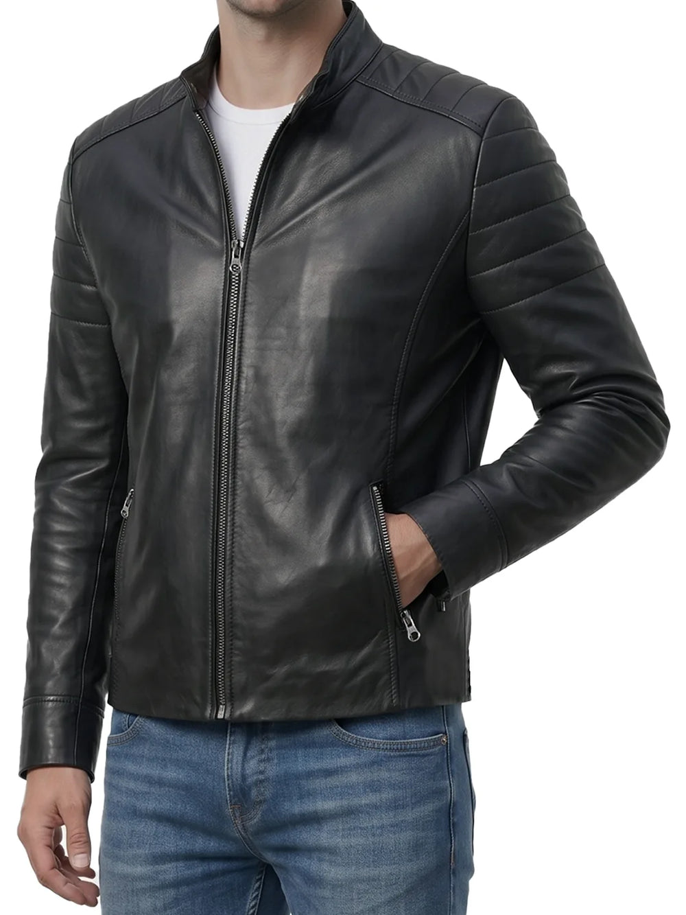 A man wearing a black leather jacket with quilted shoulder panels, a front zipper, and zippered hand pockets, paired with blue jeans against a white background.