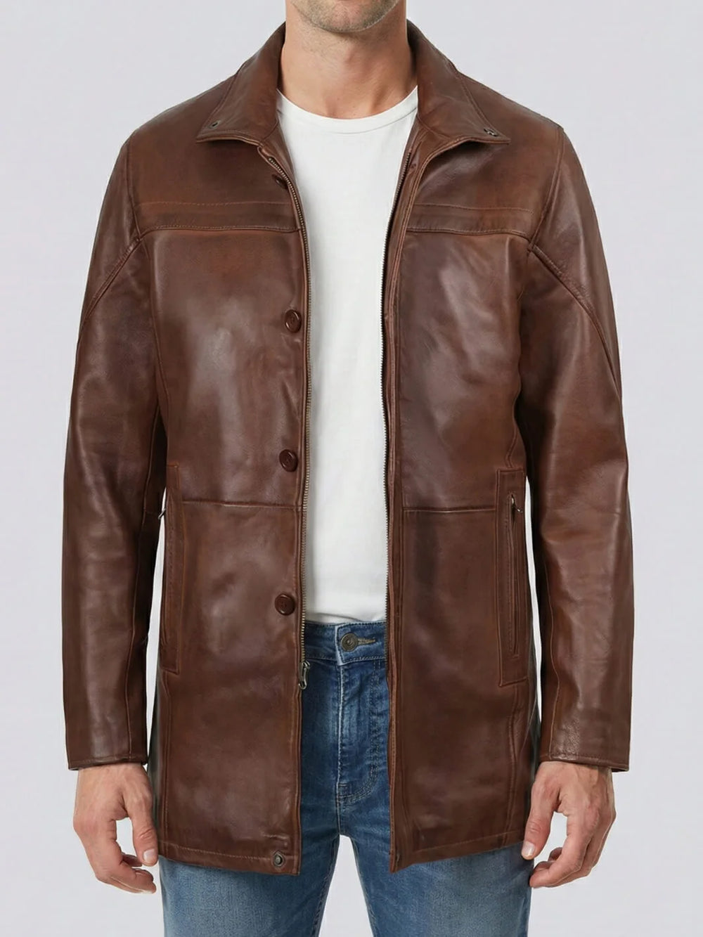 Brown leather jacket worn by a person on a plain background